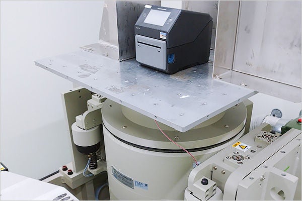 Using a vibration tester to assess how shocks and shakes during transportation affect a product